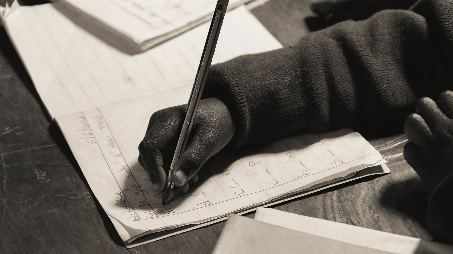 Child writing in a notebook
